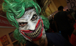 A man wearing a mask poses for a photograph during the 9th edition of ‘Comic Con’ in Mumba...
