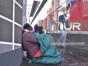 Bogdan living rough on a street in Glasgow, with only a small grasp of English during Saturday 11th April 2015. (