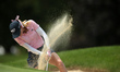Paula Creamer hits out of the bunker toward the 9th green during the third round of the Do...