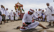 Balinese attempts to stab his body with traditional dagger called Keris while in trance du...