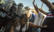 Supporters of Venezuelan opposition leader  Juan Guaido, confront members of the Bolivaria...