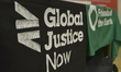 Light shining on the logo for Global Justice Now on Saturday 11th April 2015. -- Various g...