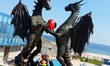 An unknown artist paited in red an egg holded by two dragons in love statue in the Black s...