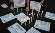 Filipinos light candles during a vigil for the missing passengers of the Malaysia Airlines...
