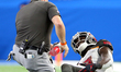 Tampa Bay Buccaneers wide receiver Chris Godwin (12) is checked for injury after a play du...