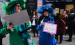 A woman holds a copy of the Spanish Christmas lottery first prize number outside the Spani...