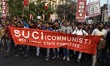 Activists  of  SUCI(C) hold poster and shouts slogan during a rally to protest against the...