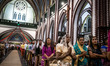 Myanmar Christian devotees pray during a Christmas Eve mass at St. Mary’s Cathedral in Yan...