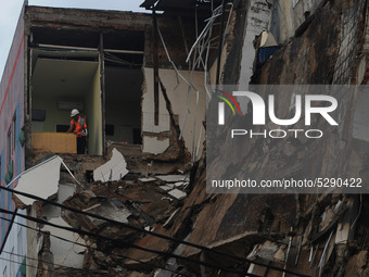  The evacuation team cut down the 5-story collapsed concrete part of the building in the Slipi area, Jakarta, in January, 6.2020. Allegedly...
