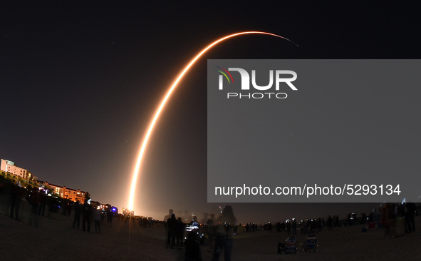 A SpaceX Falcon 9 rocket is seen in this time exposure from Cocoa Beach, Florida as it launches the company's third Starlink mission on Janu...