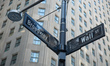 Wall Street sign inscription as seen on various buildings, Wall St address, Downtown in lo...