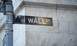 Wall Street sign inscription as seen on various buildings, Wall St address, Downtown in lo...