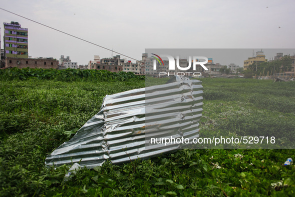 A remaining tin shed over the Hajipara Jheel, Dhaka, Bangladesh, 16 April 2015 after the collapse of two storied tin-shed house on swampy gr...