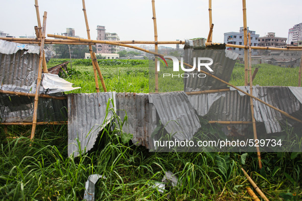 Remaining tin sheds over the Hajipara Jheel, Dhaka, Bangladesh, 16 April 2015 after the collapse of two storied tin-shed house on swampy gro...