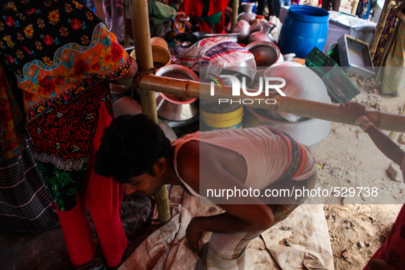Rescued goods of the family members at a temporary house after the house collapse in Dhaka, Bangladesh, 16 April 2015. 