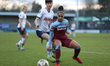  Jacynta Galabadaarachchi of West Ham United Women shielding the ball from Ashleigh Nevill...