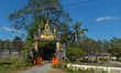 Locals and young Buddhist monks awaiting for cyclists during the second stage of the inaug...