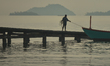 A fisherman returns at sunrise to a wooden pier with his boat in Kep city.On Tuesday, Jan...