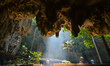 A view of Phnom Kampong Tranch.  The roof of a large cave in the center of a mountain col...