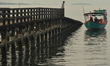 A fishing boat moored to a wooden pier in Kep city.On Tuesday, January 7, 2020, Kep City,...