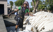 A female worker washes fabric before printing in Bagru, Jaipur district, Rajasthan, India...