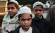 Young students with painted slogans and tricolour in protest against the Citizenship Amend...