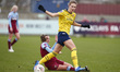  L-R Vivianne Miedema of Arsenal  holds of Cecilie Redisch Kvamme of West Ham United WFC d...