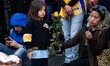 A mother and daughter leave flowers at a memorial in Los Angeles, CA on January 27, 2020. 