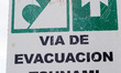 Signage with Evacuation route in case of tsunami pictured in Puerto Aisen (Aysen), Patagon...