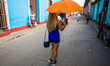 A woman walk in Trinidad, Cuba, on January 21, 2020. Trinidad is a town in the province of...