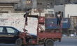 Palestinian kids stands on (Tuk Tuk) a motorcycle used in passengers and goods transportat...