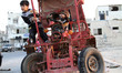 Palestinian kids stands on (Tuk Tuk) a motorcycle used in passengers and goods transportat...