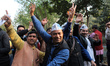 Supporters of Aam Aadmi Party celebrating party's landslide victory in Delhi Assembly Elec...