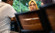Mrs. ILYAS (Yellow Hijab) were talking with DIZA (purple hijab) at the airport after the h...