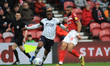  Kazenga LuaLua of Luton Town in action with Middlesbrough's Harold Maoukoudi during the S...