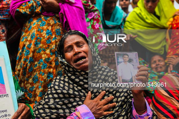 A Bangladeshi relative of a victim of the Rana Plaza building collapse weeps as she marks the second anniversary of the disaster at the site...