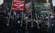  A few hundred people protest in front of Parliament with the demand to fire the head of a...