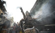 An artist dressed as Hindu God Shiva,performs during the procession of Maha Shivaratri fes...