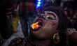 An artist dressed as Hindu God Shiva,performs during the procession of Maha Shivaratri fes...