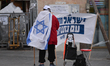 Likud political party campaigner seen near the entrance to Mahane Yehuda market.Israelis...