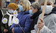 Ukrainian medical workers wearing face masks participate at a rally against health reform,...