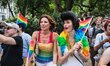 Parade goers enjoying the sights and sounds of the 2013 New York City Pride Parade, which...