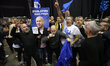 Supporters of Israeli Prime Minister Benjamin Netanyahu celebrate after the release of exi...