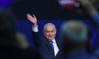 Israeli Prime Minister Benjamin Netanyahu gestures as he speaks to supporters following th...