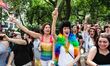 Parade goers enjoying the sights and sounds of the 2013 New York City Pride Parade, which...