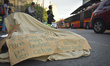 A bicycle covered by a blanket shows a sign remembering a dead cyclist  during a protest o...