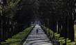 A jogger is seen around The Lincoln Memorial amid a dramatic downturn in tourists due to t...