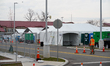  New York State Police Officers and Army National Guardsmen wear protective gear while wor...