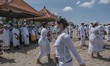 People wear a protective mask as they attend the Melasti ritual in Bali, Indonesia, on Mar...