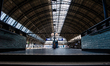 The Central train station in Amsterdam is empty, since less trains are circulating during...